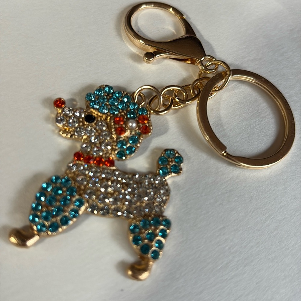 Sparkling poodle dog Keychain with blue orange Accents